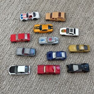 VINTAGE LOT OF 12 1/64 Metal Cars. Mostly HOT WHEELS. Various Years 1970’s-80’s.